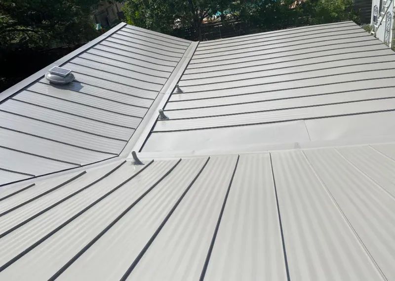 Solar attic fan installed on a metal roof for Roof Ventilation in Long Beach
